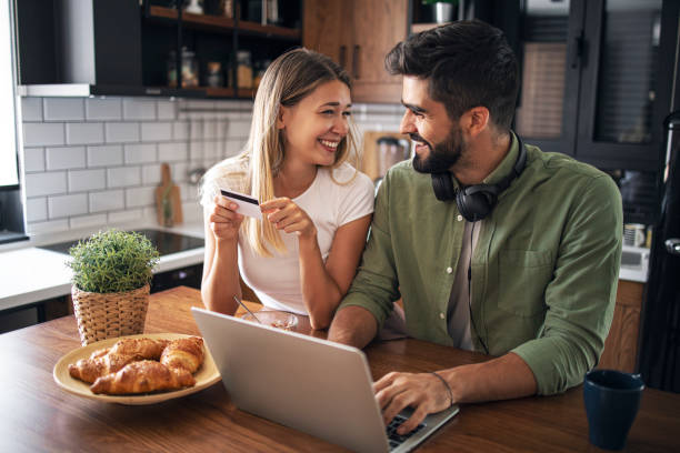 istock Man and women using laptop and laughing 1283497930
