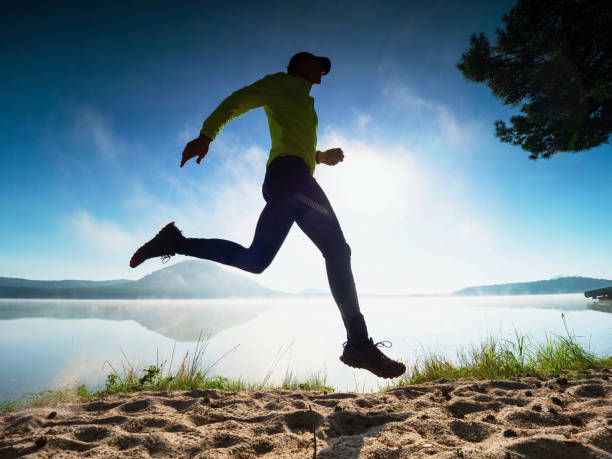 istock Caucasian man training on the beach in morning. 1283498071