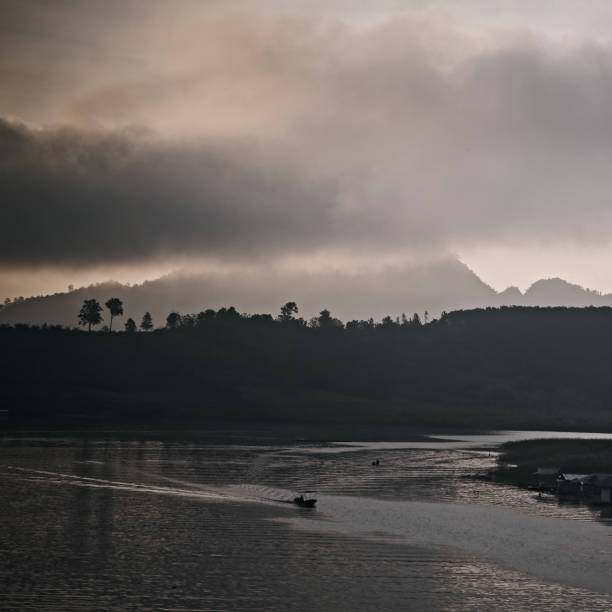 istock The lake at morning fog. 1283498759