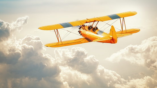 historical biplane into the clouds