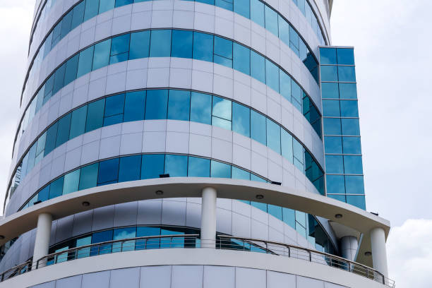 istock Circular building with lots of blue glass. 1283499787