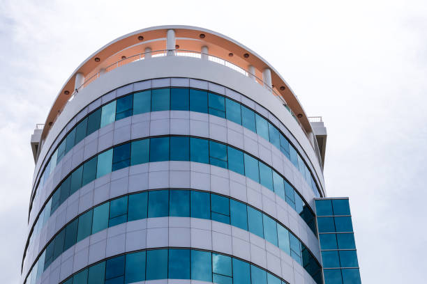 istock Circular building with lots of blue glass. 1283499789