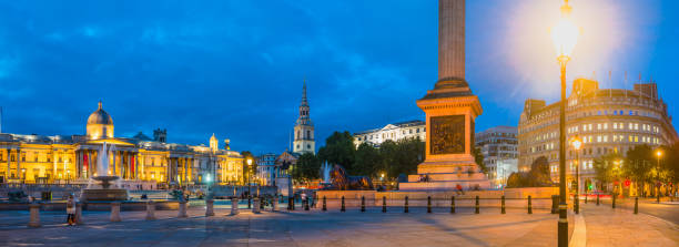istock London Trafalgar Square Nelson's Column illuminated at dusk panorama UK 1283499888