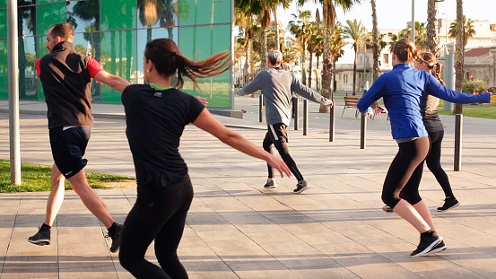 Group of people in a fitness class outdoors in Barcelona