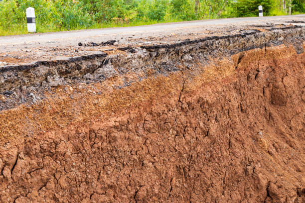 istock Soil under the road, which has been eroded in the countryside. 1283500346