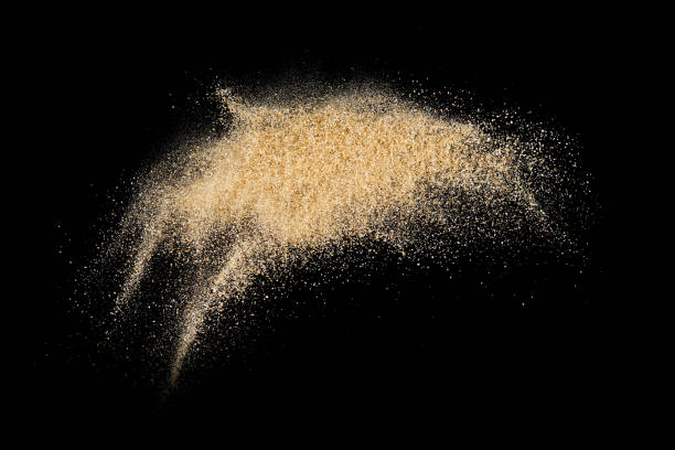 istock Sand splash explosion isolated on black background ,throwing freeze stop motion object design 1283500595