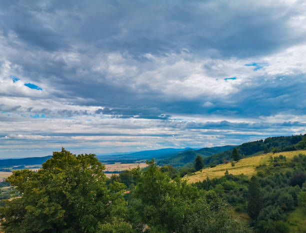 istock Look to small village in mountains and fields 1283501174