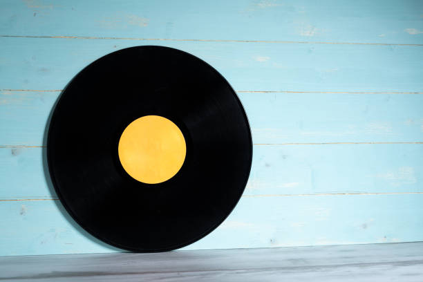 istock Vinyl record on blue wooden background 1283501385
