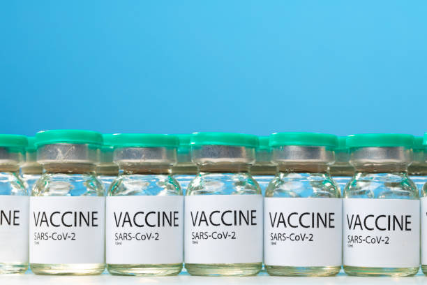 istock Sars-cov-2 vaccine vial bottles on white table 1283501418