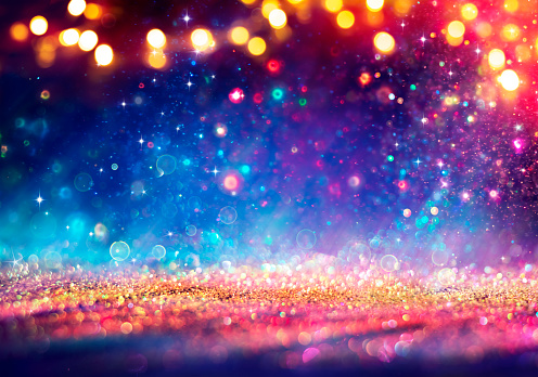 Abstract Defocused Christmas Background - Shiny Golden Glitter With Bokeh Lights On Blue Background