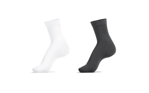 istock Blank black and white long socks mockup on tiptoe, isolated 1283503577