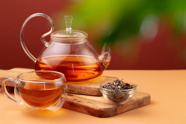 istock Glass teapot and cup with black tea 1283504648