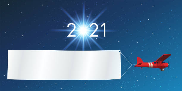 ilustrações de stock, clip art, desenhos animados e ícones de 2021 greeting card showing a red plane pulling a white banner in front of a starry sky. - classified ad internet advertisement marketing