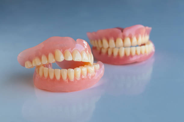 istock The dentures of the two elderly people were placed on a shiny white table. 1283504752