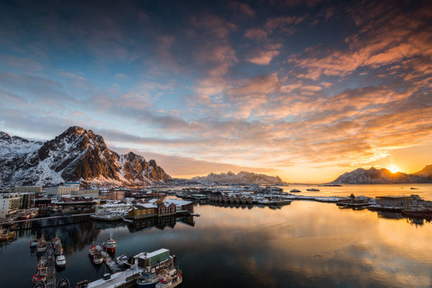 View over the port of Svolvaer on the Lofoten islands in colorful early morning sunrise in winter with snow View over the port of Svolvaer on the Lofoten islands in colorful early morning sunrise in winter with snow harbor of svolvaer in winter lofoten islands norway stock pictures, royalty-free photos & images