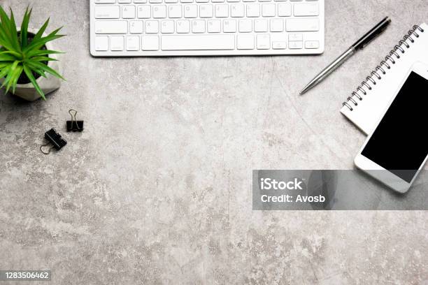 White Desk Office With Laptop Smartphone And Other Work Supplies With Cup Of Coffee Top View With Copy Space For Input The Text Designer Workspace On Desk Table Essential Elements On Flat Lay Stock Photo - Download Image Now