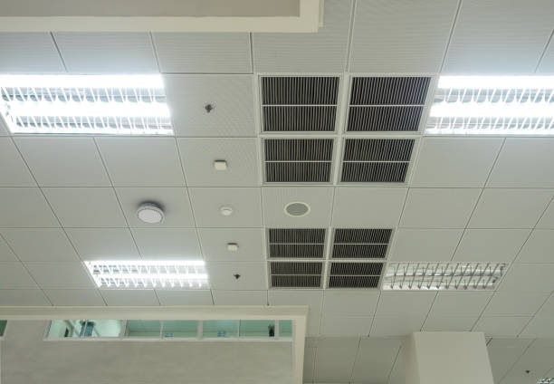 istock Air conditioning mask, lighting and modern equipment On the ceiling, selected switch-off some lighting for energy save 1283507734