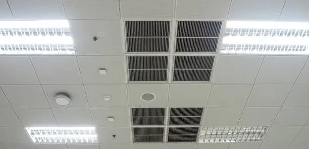 Air conditioning mask, lighting and modern equipment On the ceiling, selected switch-off some lighting for energy save