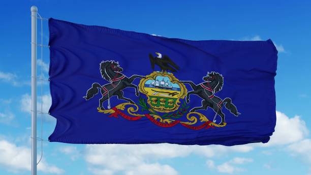 istock Pennsylvania flag on a flagpole waving in the wind, blue sky background. 3d rendering 1283508566
