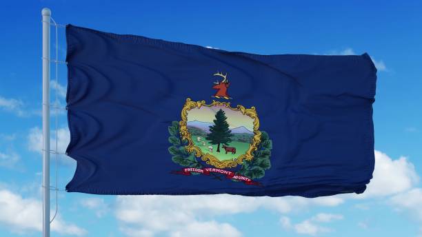 istock Vermont flag on a flagpole waving in the wind, blue sky background. 3d rendering 1283508602