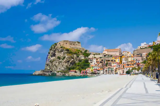 Photo of Watercolor drawing of seaside town village Scilla with old medieval castle on rock Castello Ruffo, colorful traditional typical italian houses on Mediterranean Tyrrhenian sea coast, Calabria, Italy