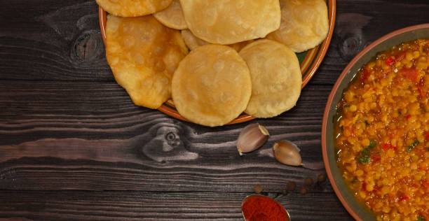 istock Indian cuisine. Luchi tortillas with cooked vegetables. 1283509693