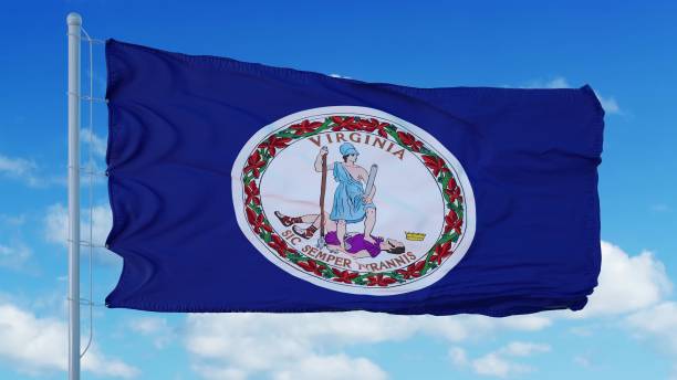 istock Virginia flag on a flagpole waving in the wind, blue sky background. 3d rendering 1283509828