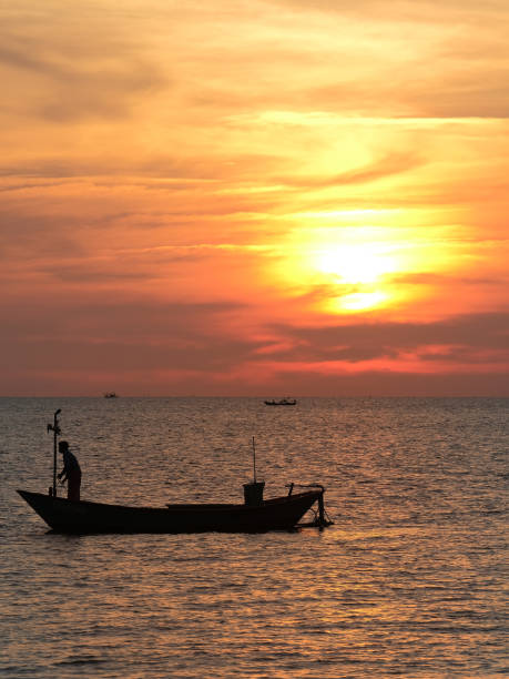 istock Silhouette of fisherman. 1283509838