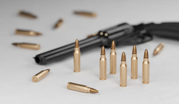 istock Many bullets and gun in background. 3D rendered illustration. 1283510038