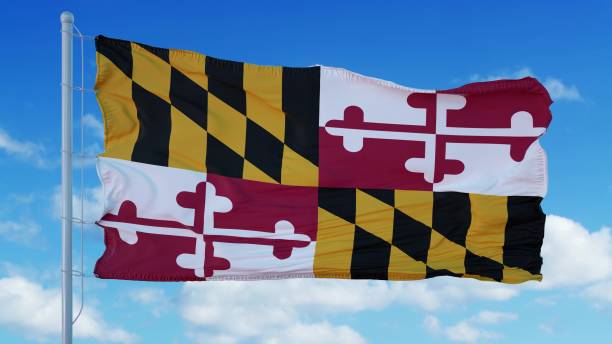 istock Maryland flag on a flagpole waving in the wind, blue sky background. 3d rendering 1283510070
