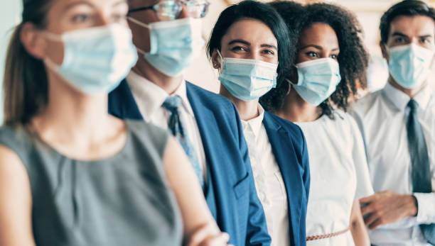 istock Business team with face protective mask 1283510158
