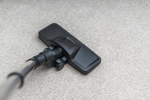 istock Vacuum cleaner is cleaning dust from carpet. Housework cocnept. 1283510182