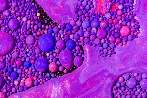 istock Fluid art texture. Background with abstract swirling paint effect. Liquid acrylic picture with flowing bubbles. Mixed paints for background or poster. Purple, blue and pink overflowing colors. 1283511361