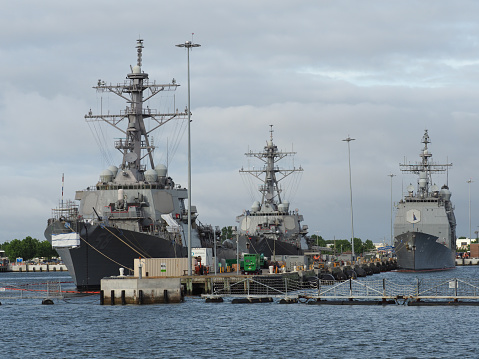 Norfolk, USA - June 9, 2019: Several naval vessels anchor in the Norfolk Naval Base.