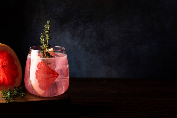 alcoholic cocktail with vodka and grapefruit juice in a glass with ice