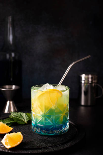 istock blue curacao cocktail with orange juice and orange slices 1283514309