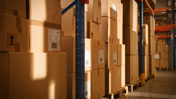 istock In Big Retail Warehouse Moving Sunlight Illuminates Shelves with Cardboard Boxes. Logistics, Distribution Center with Products Ready for Global Shipment, Customer Delivery. 1283514399