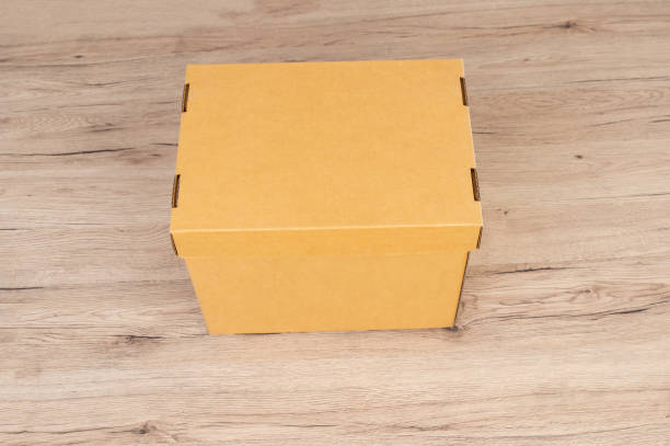 istock A brown box delivery placed on a wooden table for packaging 1283519316