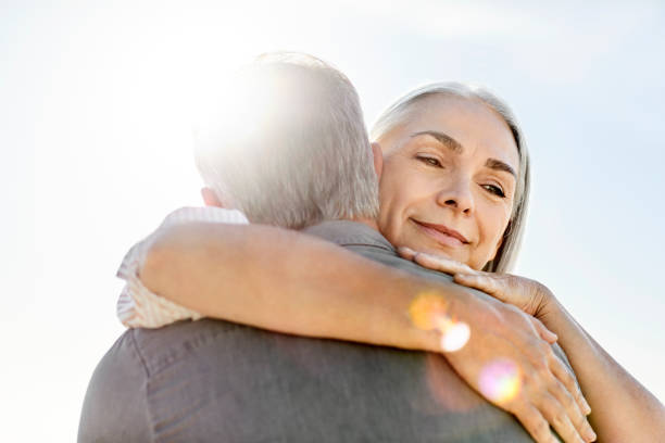 istock Smiling mature man embracing man during vacation 1283520805