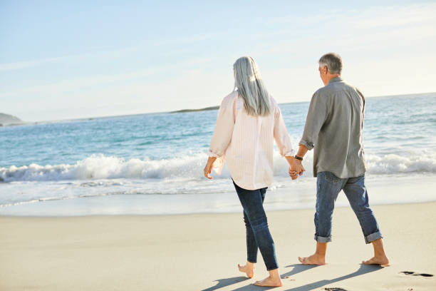 istock Romantic couple walking at beach during sunny day 1283520852