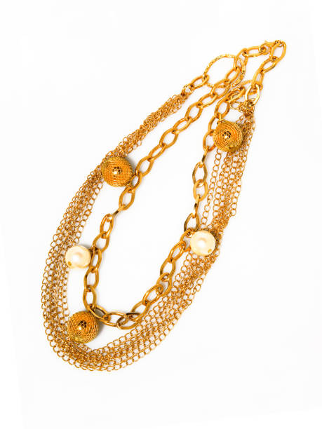 istock Women`s golden necklace on white background 1283521889