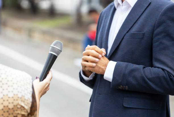 istock Journalist making media interview with unrecognizable person. Vox populi concept. 1283522250