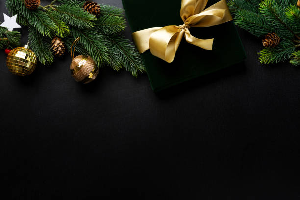 istock Christmas deco with fir and baubles on dark 1283523094