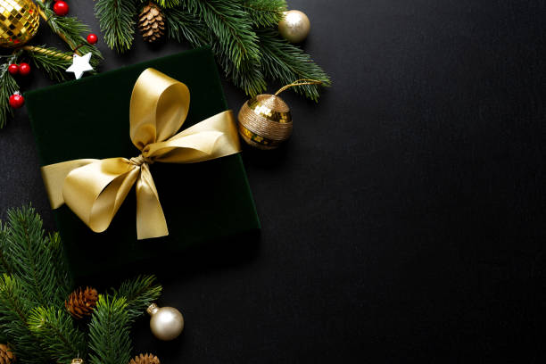 Christmas deco with fir and baubles on dark