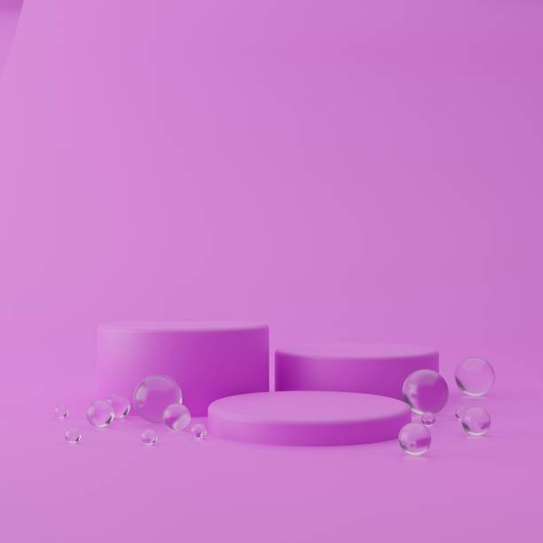 istock Three cylindrical geometric mockups of the podium on bright violet colored background with round glass balls on the floor. Minimalistic trendy style for cosmetics advertising. 3d render illustration. 1283523404