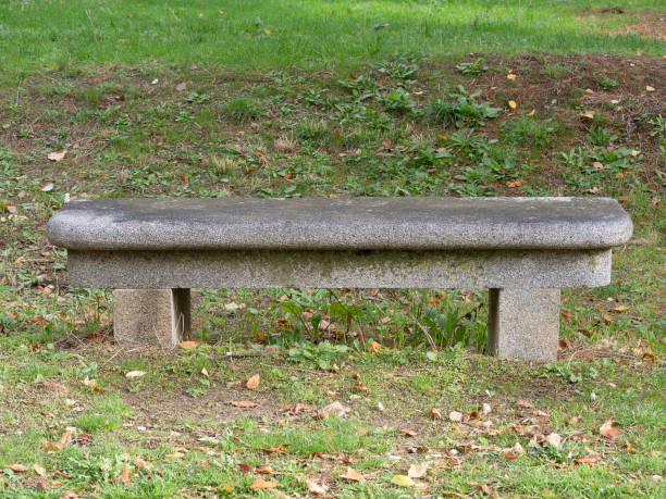 istock Ancient stone bench in a old european park 1283526165