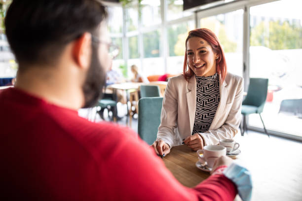 istock Friends enjoying pleasant conversation over coffee in cafe 1283526299