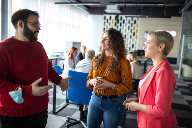 istock Young businesspeople talking about work in their modern startup office 1283526789