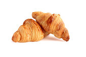 Two freshly backed french croissants close-up.