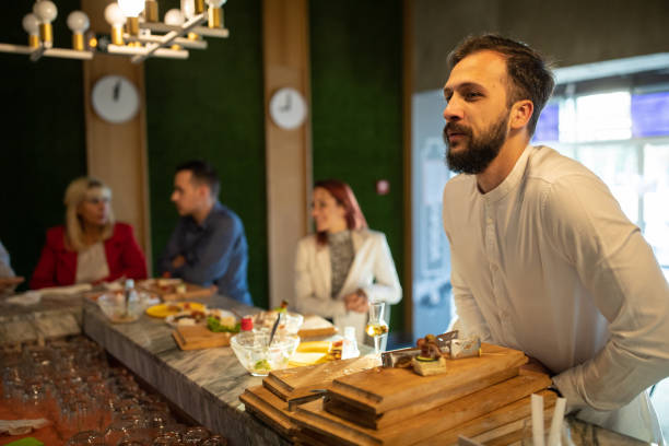 istock Businessman ordering a drink in bar after work 1283527577